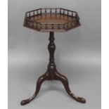 A GEORGE III MAHOGANY WINE TABLE, the octagonal galleried top on tripod base, 69cm high, 40cm wide