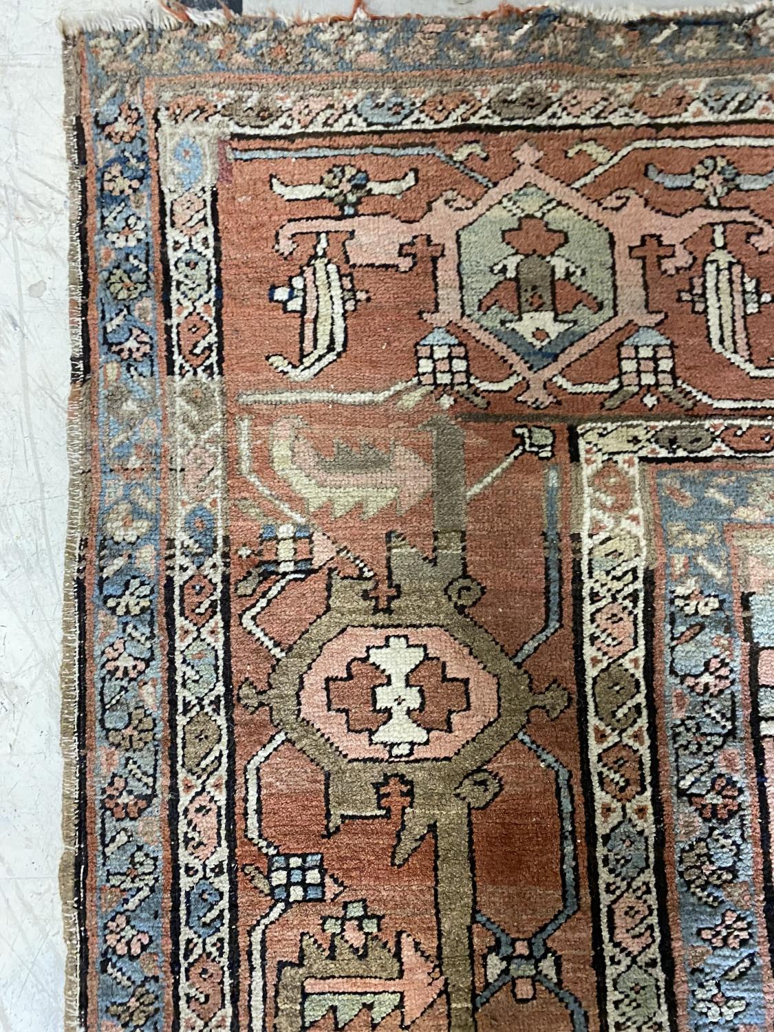 A HERIZ CARPET c1870. Iranian Azerbaijan, The stepped terracotta fields centred by an indigo and - Image 16 of 16
