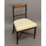 A CONTINENTAL EARLY 19TH CENTURY MAHOGANY AND BRASS SIDE CHAIR. With a rectangular back with a