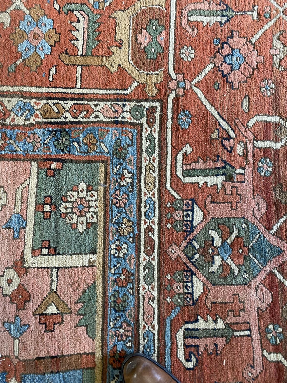 A HERIZ CARPET c1870. Iranian Azerbaijan, The stepped terracotta fields centred by an indigo and - Image 12 of 16