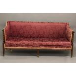A GEORGE III MAHOGANY FRAMED SOFA. A Hepplewhite style sofa with a rectangular upholstered and