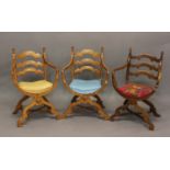 A SET OF THREE SPANISH STYLE X FRAMED ARM CHAIRS. Three walnut chairs with three curved cross