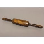 A VICTORIAN LABURNUM WOOD ROLLING PIN. Turned from a single piece of laburnum with a bulbous
