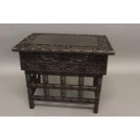 A 19TH CENTURY CHINESE HARDWOOD TRAVELLING TABLE, the shaped rectangular top carved with dragons and