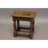 AN OAK JOINT STOOL OF 16TH CENTURY DESIGN with gouged frieze and fluted legs; 43 cms