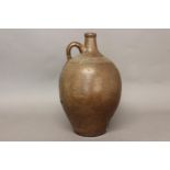 A LARGE 19TH CENTURY SALT GLAZED FLAGON. A large stoneware saltglazed flagon with a narrow neck loop