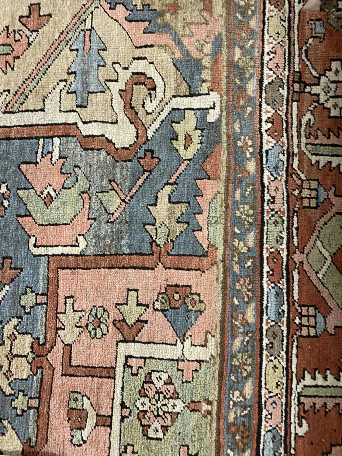 A HERIZ CARPET c1870. Iranian Azerbaijan, The stepped terracotta fields centred by an indigo and - Image 7 of 16