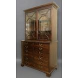 A GEORGE III MAHOGANY SECRETAIRE BOOKCASE the upper part with astragal glazed doors and interior