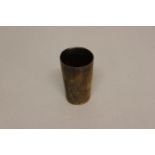 A 19TH CENTURY HORN BEAKER. Of straight sided tapering form with pricked decoration, 9cm high 5.