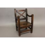 AN EARLY 19TH CENTURY OAK CHILD'S CHAIR. With a square back with 'x' form rails, shaped arm