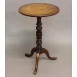 A SMALL LATE 18TH CENTURY TRIPOD TABLE. With a circular top on a turned column with three downsept