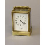 A BRASS CASED CARRIAGE CLOCK BY MOTTU OF PARIS. With a silvered rectangular dial with Roman numerals