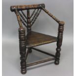 AN EARLY 17TH CENTURY TURNERS CHAIR. An ash and oak turners chair with a broad turned top rail