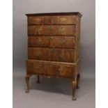 A GEORGE I/II WALNUT CHEST ON STAND. The upper section with a moulded cornice above two short and