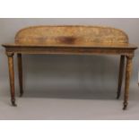 A REGENCY MAHOGANY SERVING TABLE. The rectangular top with beeded border and a raised curved back,