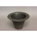 A 19TH CENTURY PEWTER CHAMBER POT. With a broad rim with four touch marks, the body tapering to a