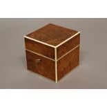 A SQUARE BURR WALNUT SCENT BOTTLE BOX. The top and sides with burr walnut veneers and ivory edges,