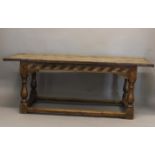 A 17TH CENTURY STYLE YEW WOOD DINING TABLE. With a broad three plank top with shaped end rails, on a