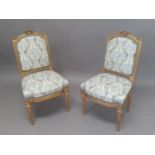 A PAIR OF LOUIS XVI STYLE SALON CHAIRS, 19th century, the gilt frames with pierced ribbon top