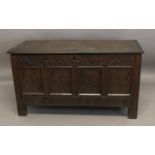 A LARGE LATE 17TH/EARLY 18TH CENTURY COFFER. With a broad rectangular top with moulded front edge