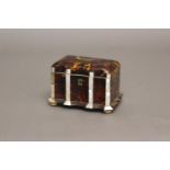A REGENCY TORTOISESHELL VENEERED TEA CADDY. A rectangular tea caddy with moulded front, the
