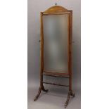 A GEORGE III STYLE MAHOGANY FRAMED CHEVAL MIRROR. With a rectangular bevel edged plate within an