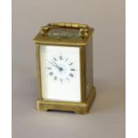 A 19TH CENTURY FRENCH BRASS CASED CARRIAGE CLOCK AND TRAVELLING CASE. With a rectangular white