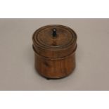 A LATE 19TH CENTURY ROSEWOOD AND EBONY TOBACCO BOX. Of turned circular form, the pull off lid with a