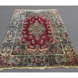 KIRMAN CARPET, SOUTH EAST IRAN, CIRCA 1950 The pale aubergine field sparsely decorated with floral