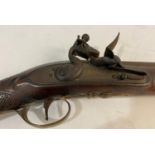 A FLINTLOCK LONG GUN BY ANDERSON. With a 91cm tapering barrel with three proof marks and flintlock