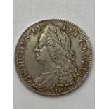 A GEORGE II HALFCROWN. A George II Halfcrown dated 1745, Lima below laureate and draped bust, Rim