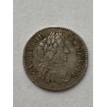 A CHARLES II SIXPENCE. A Charles II Sixpence dated 1683, draped bust r. conjoined 'C's in angles.