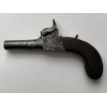 A 19TH CENTURY WAISTCOAT PISTOL. A small percussion action pistol with a 3.5cm screw off barrel, the