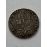 A GEORGE II HALFCROWN. A George II Lima Halfcrown dated 1745, Old Laureate bust l, reverse plain