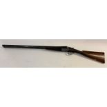 A 12 BORE SHOTGUN BY TOLLEY OF LONDON. With 71cm side by side barrels, engraved to the top 'J & W