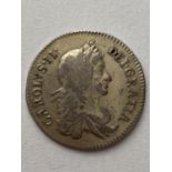 A CHARLES II SHILLING. A Charles II shilling dated 1668, second draped bust r. reverse Crossed 'C'