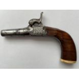 A 19TH CENTURY WAISTCOAT PISTOL. A small percussion action pistol with a 3.8cm screw off barrel, the