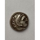 AN ALEXANDER THE GREAT DRACHM. Alexander the Great (326-323 B.C.) Silver Drachm, obverse wearing