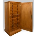 OAK COLLECTORS CABINET a late 19thc or early 20thc cabinet, with 18 internal drawers (each drawer