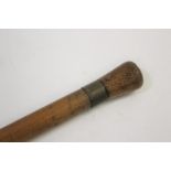 BARREL MEASURING WALKING STICK a bamboo walking stick with a concealed wooden and brass topped