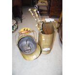 BRASS HELMET SHAPED COAL SCUTTLE, ANOTHER BRASS COAL SCUTTLE WITH BLUE AND WHITE POTTERY HANDLES,