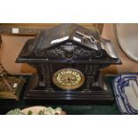 VICTORIAN POLISHED SLATE MANTEL CLOCK OF ARCHITECTURAL FORM WITH ARABIC NUMERAL DIAL