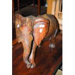 CARVED AND STAINED WOOD FIGURE OF AN ELEPHANT