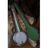 AN IVORY QUEEN BANJO IN CARRY CASE