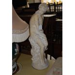 A DECORATIVE PLASTER FIGURE OF A CLASSICAL MAIDEN