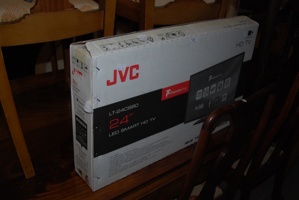 AN ALMOST NEW JVC 24" LED SMART HD TV COMPLETE WITH PACKAGING AND BOX