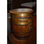 VINTAGE OAK AND BRASSBOUND BARREL WITH LATER OVAL WOODEN TOP FORMING A SEAT, THE BRASS TAP INSCRIBED