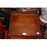 A 19TH CENTURY MAHOGANY WRITING SLOPE WITH HINGED FRONT OPENING TO FITTED INTERIOR WITH TWO SMALL