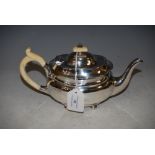 SHEFFIELD SILVER BACHELORS TEAPOT, OVAL SHAPED ON FOUR BUN FEET. GROSS WEIGHT 12.8 TROY OZ.