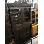 19TH CENTURY OAK SIDE CABINET THE UPPER SECTION WITH TWO GLAZED CUPBOARD DOORS, THE LOWER SECTION